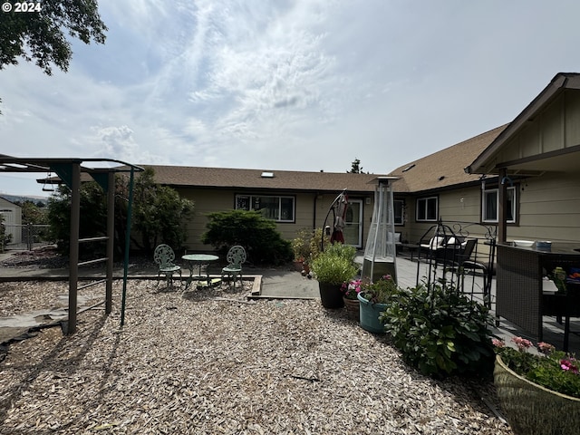 rear view of property featuring a patio