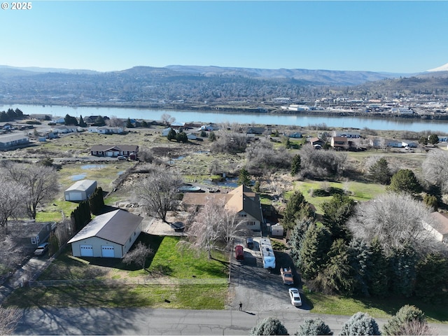 bird's eye view featuring a water and mountain view