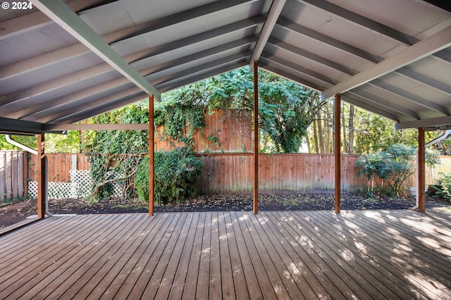 wooden terrace featuring a fenced backyard