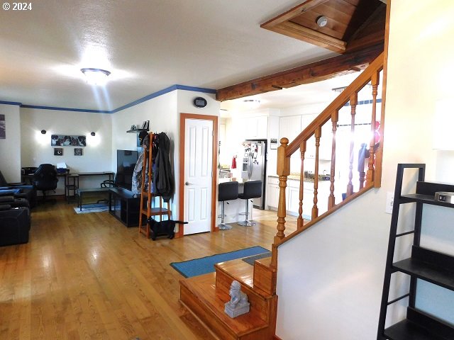 entrance foyer featuring hardwood / wood-style flooring and ornamental molding