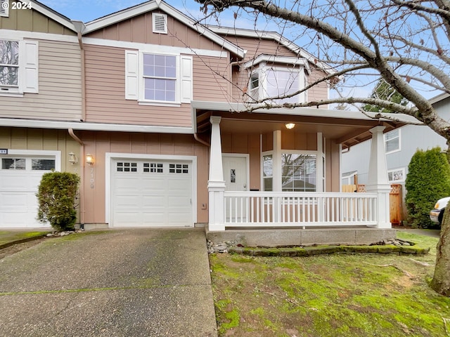 view of front of property with covered porch and a garage