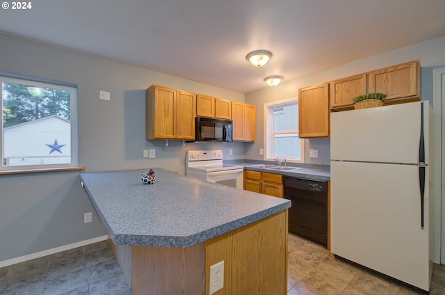 kitchen featuring kitchen peninsula, light tile patterned floors, black appliances, and sink