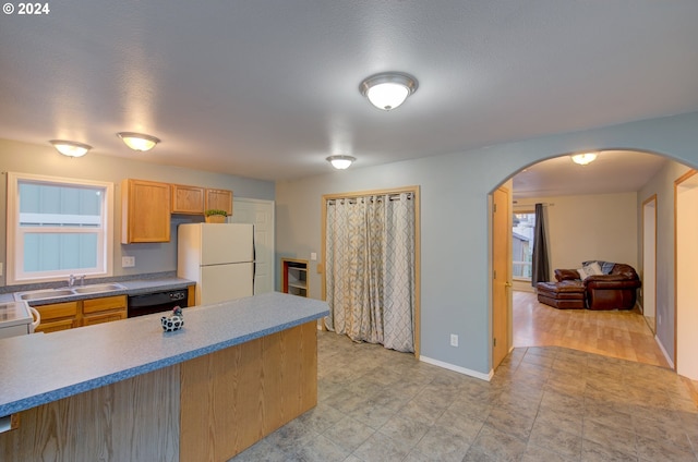 kitchen with light tile patterned floors, sink, white fridge, and dishwasher