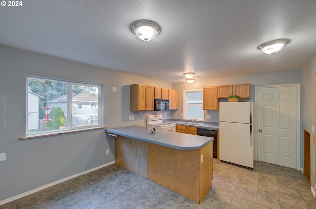 kitchen with light tile patterned floors, sink, kitchen peninsula, and black appliances