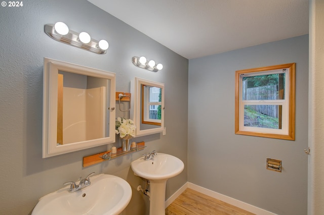 bathroom featuring sink and wood-type flooring