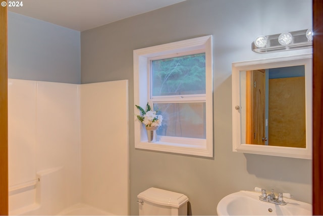 bathroom featuring sink and toilet