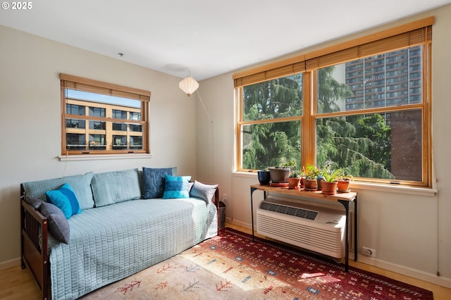 1134 SW Jefferson St Unit 506, Portland, OR 97201 - living area with plenty of natural light, baseboards, and a wall mounted air conditioner