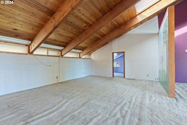 interior space featuring beamed ceiling, high vaulted ceiling, carpet floors, and wood ceiling