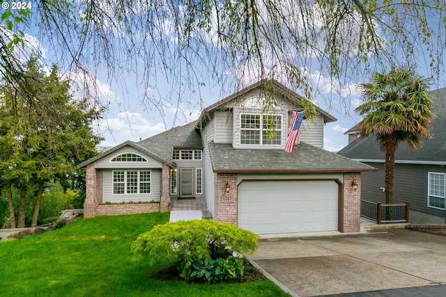 view of front of property featuring a garage and a front yard