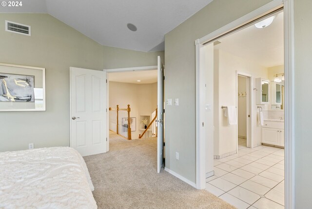 carpeted bedroom featuring a water view, vaulted ceiling, and ceiling fan