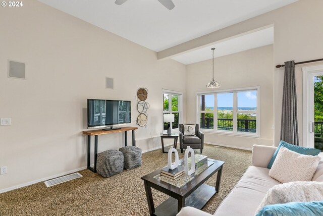 kitchen with white cabinets, white refrigerator, kitchen peninsula, and a breakfast bar area