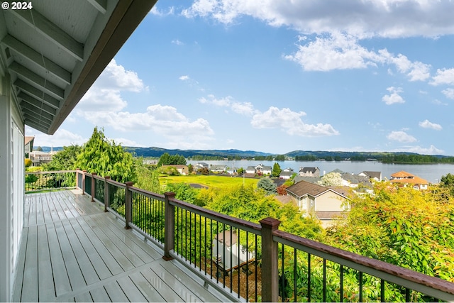 wooden deck featuring a water view