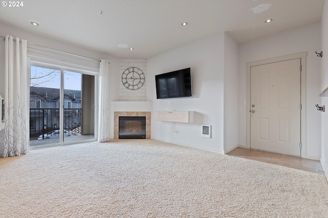 unfurnished living room with light colored carpet