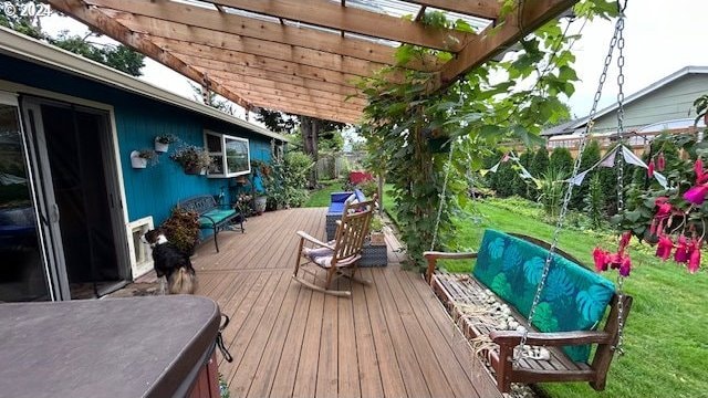 deck featuring a pergola and a yard