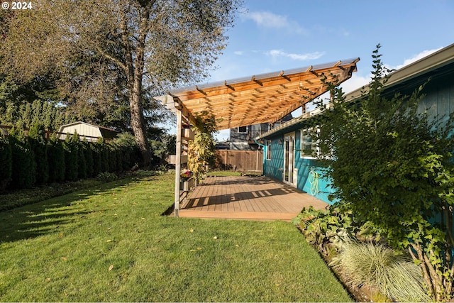 view of yard featuring a pergola and a deck