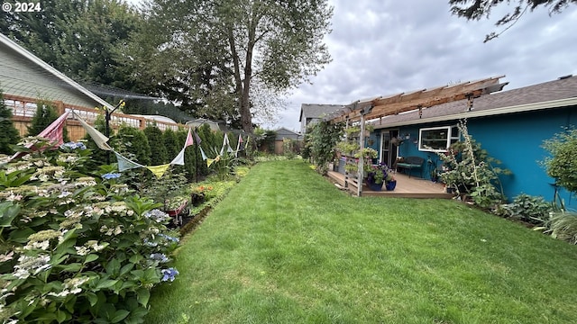 view of yard featuring a pergola and a wooden deck