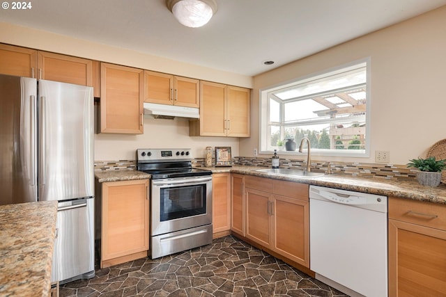 kitchen with appliances with stainless steel finishes and sink