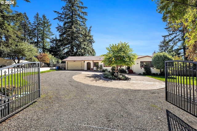 single story home with a front lawn and a garage