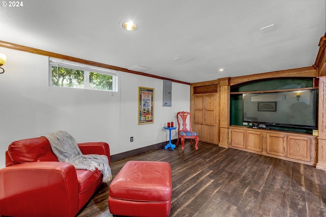 living room with dark hardwood / wood-style flooring, electric panel, and crown molding