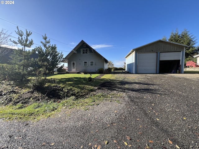 exterior space with a garage and an outdoor structure