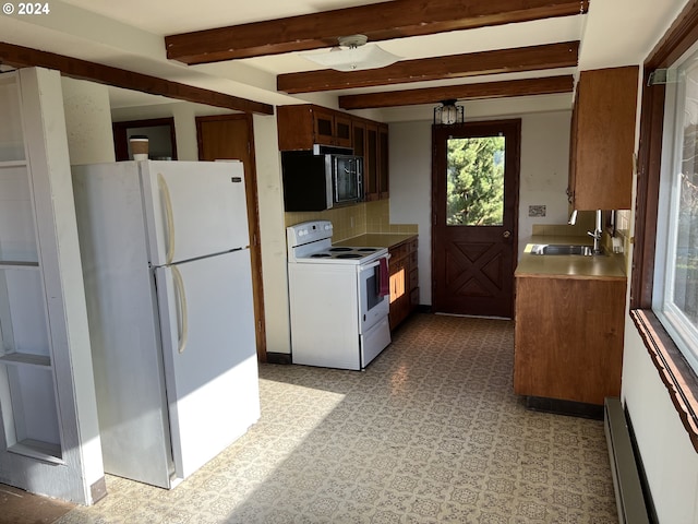 kitchen featuring beamed ceiling, white appliances, a wealth of natural light, and backsplash