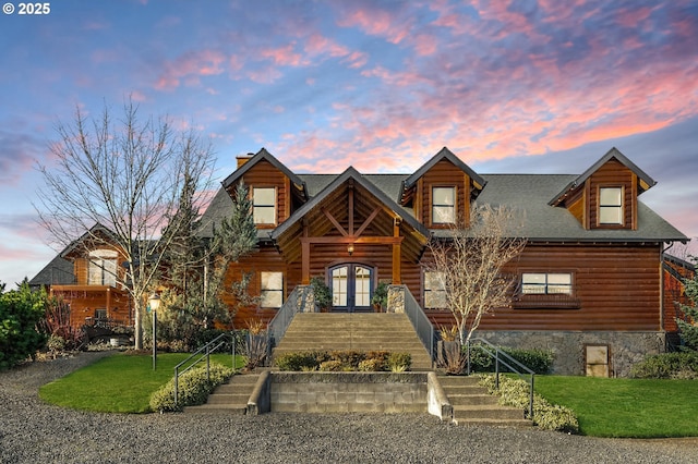 log cabin with a yard and french doors