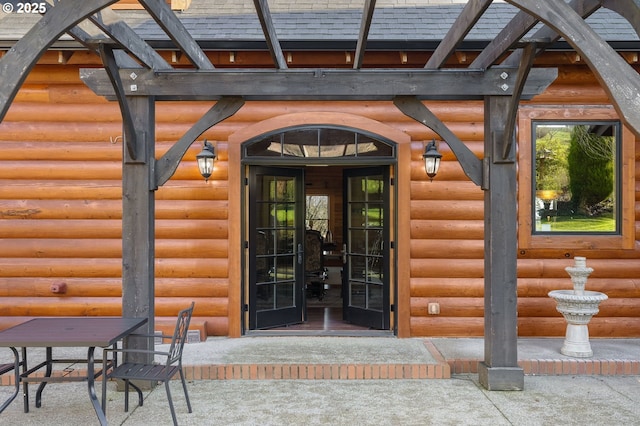 entrance to property with a patio area