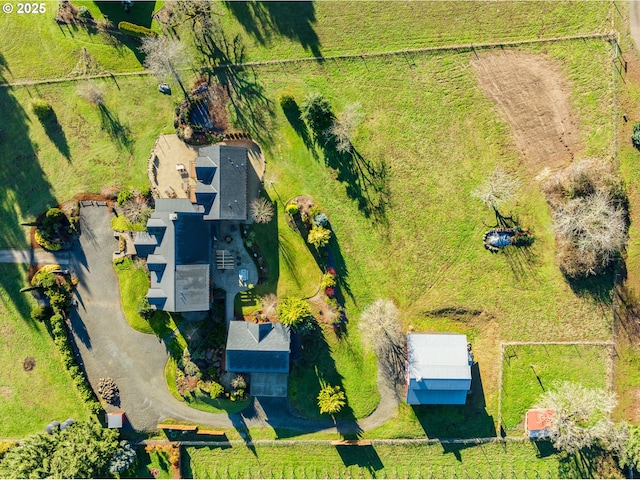 birds eye view of property with a rural view