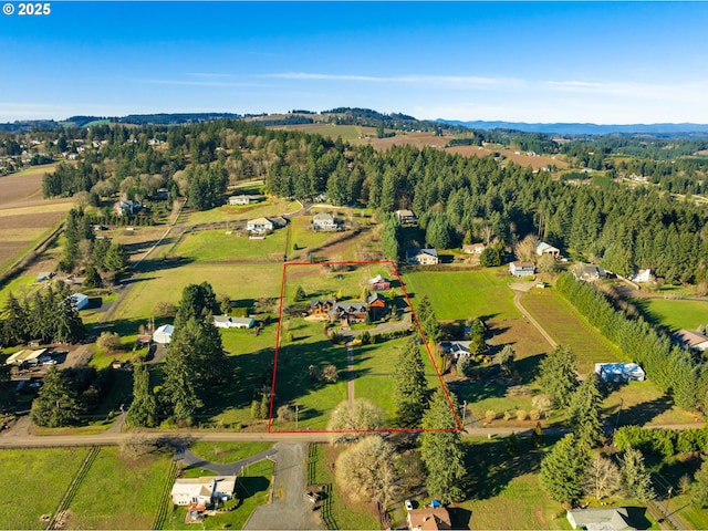 birds eye view of property featuring a rural view