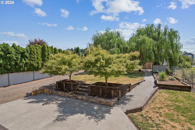 exterior space featuring a yard and a storage unit