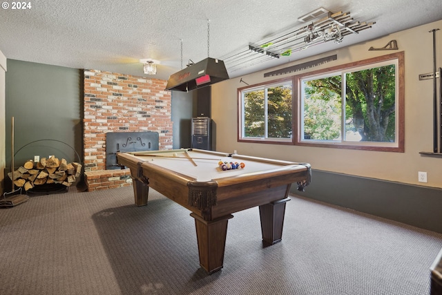 rec room with billiards, carpet floors, and a textured ceiling