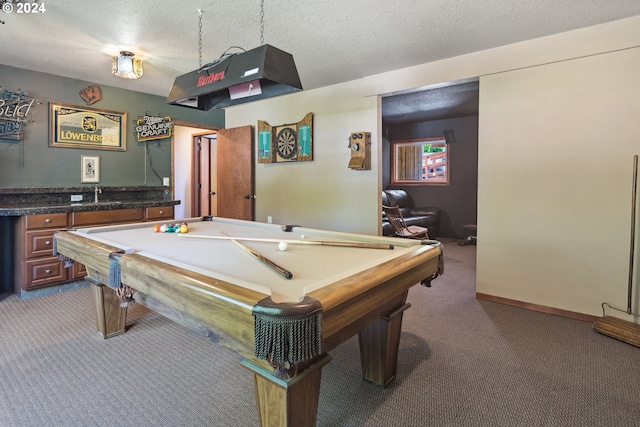 recreation room with a textured ceiling, billiards, and dark carpet