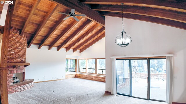 1081 Umpqua College Rd, Roseburg, OR 97470 - unfurnished living room with high vaulted ceiling, wooden ceiling with exposed beams, a chandelier, a brick fireplace, and carpet flooring