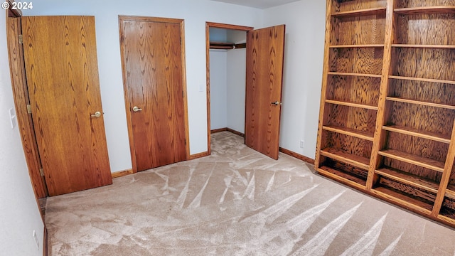 1081 Umpqua College Rd, Roseburg, OR 97470 - unfurnished bedroom featuring carpet, baseboards, and two closets
