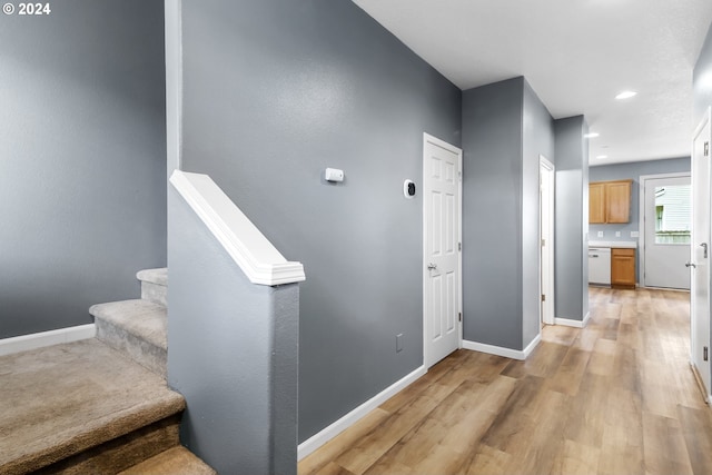 stairway featuring hardwood / wood-style floors