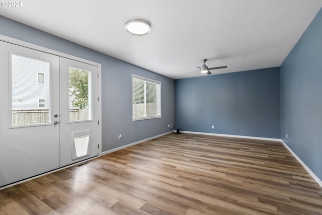 entryway with ceiling fan and hardwood / wood-style floors