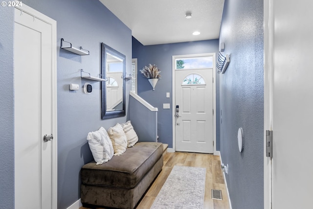 foyer entrance with light wood-type flooring