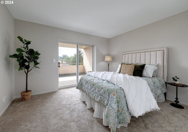 carpeted bedroom featuring access to outside