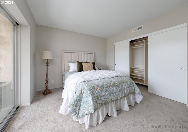 carpeted bedroom featuring a closet