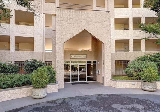 entrance to property with a balcony