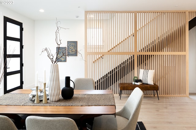 dining space with light wood-type flooring