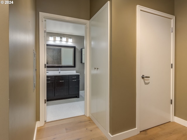 bathroom with vanity and hardwood / wood-style flooring