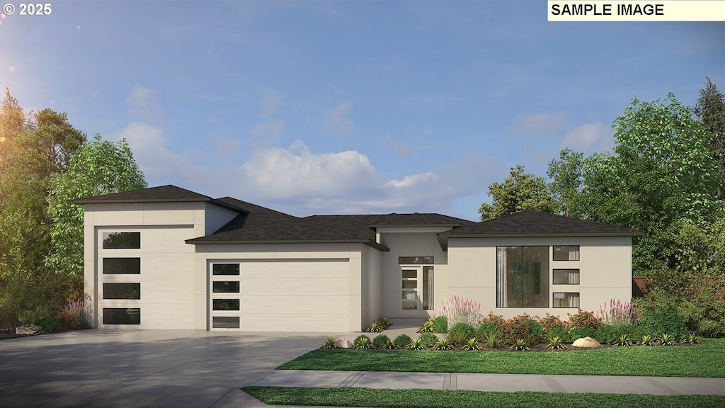 prairie-style home with an attached garage, driveway, a front yard, and stucco siding