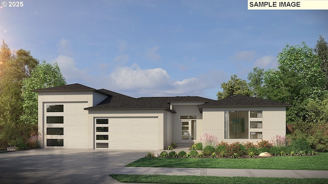 prairie-style home with an attached garage, driveway, a front yard, and stucco siding