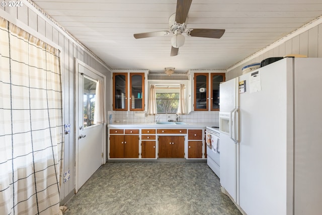 kitchen featuring ornamental molding, sink, decorative backsplash, white appliances, and ceiling fan