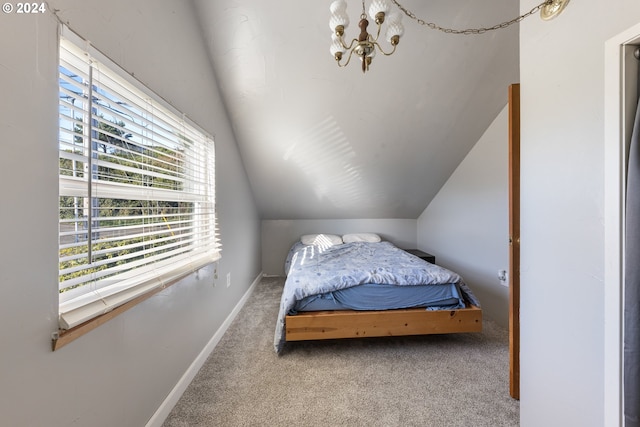 bedroom featuring carpet, a chandelier, and vaulted ceiling