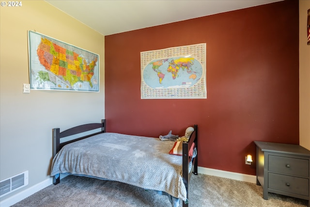 bedroom featuring light carpet