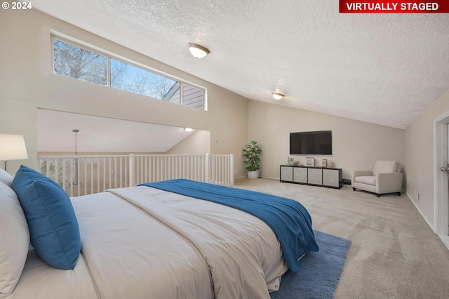 bedroom featuring carpet flooring, a textured ceiling, and vaulted ceiling