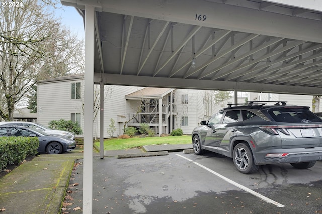 view of vehicle parking featuring a carport