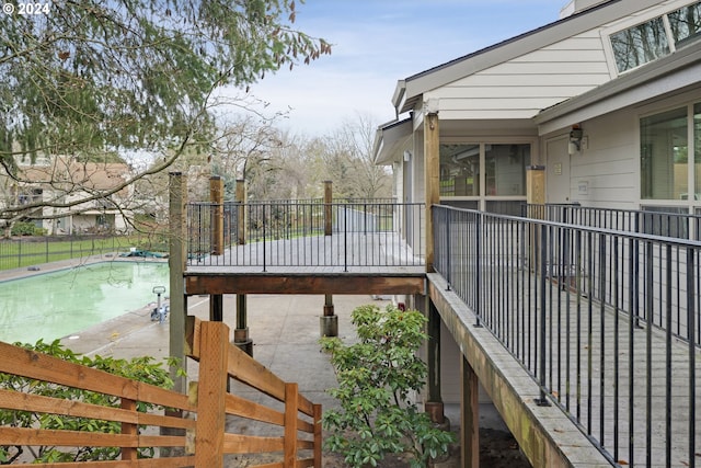 wooden terrace featuring a patio